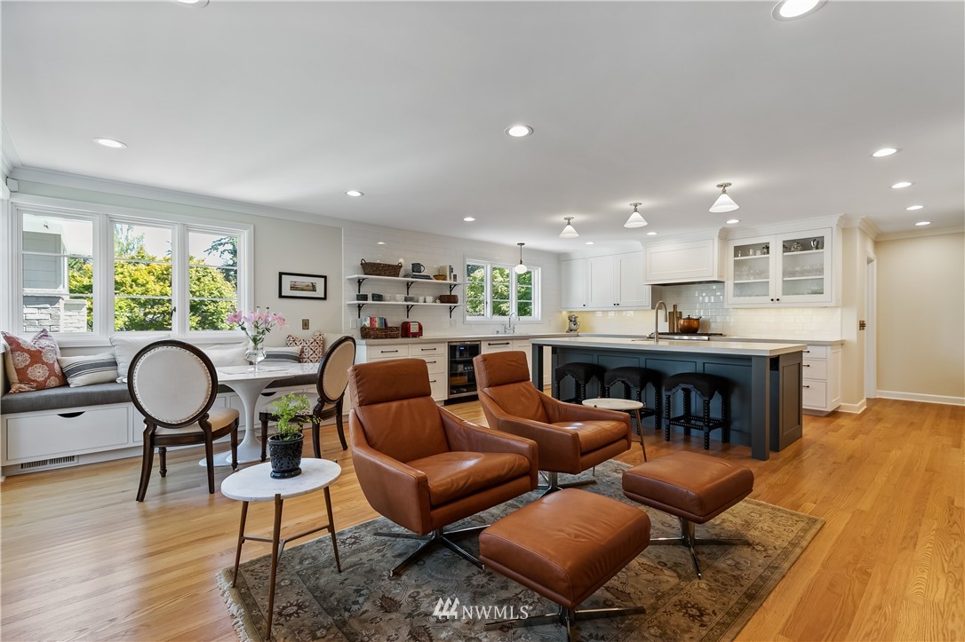 245 Middlefield Road Bellingham, WA 98225 - Photo 12 of 40 a living room with furniture kitchen view and a wooden floor