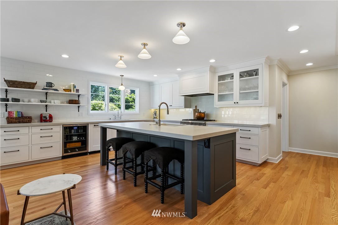 245 Middlefield Road Bellingham, WA 98225 - Photo 16 of 40 a kitchen with stainless steel appliances granite countertop a stove a sink dishwasher and a refrigerator with wooden floor