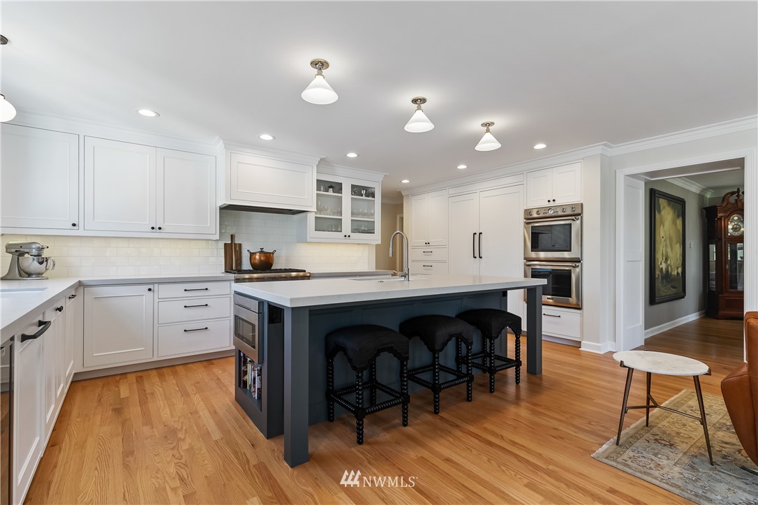 245 Middlefield Road Bellingham, WA 98225 - Photo 17 of 40 a kitchen with a wooden floor and cabinets