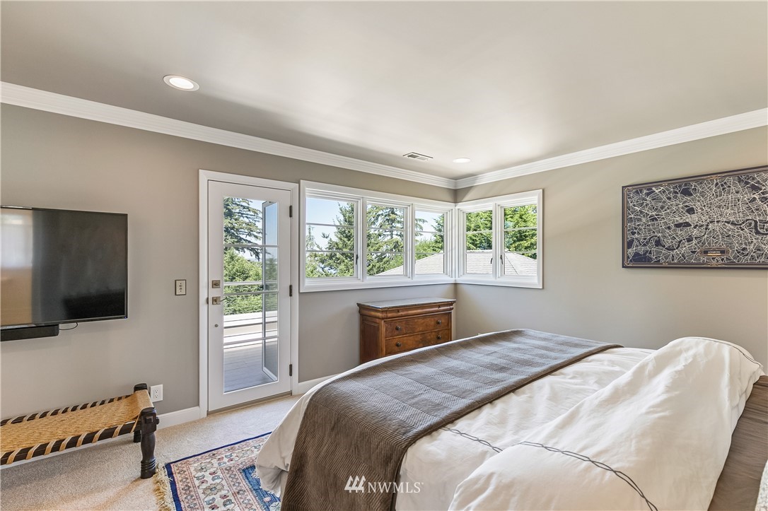 245 Middlefield Road Bellingham, WA 98225 - Photo 19 of 40 a bedroom with a bed and a flat screen tv