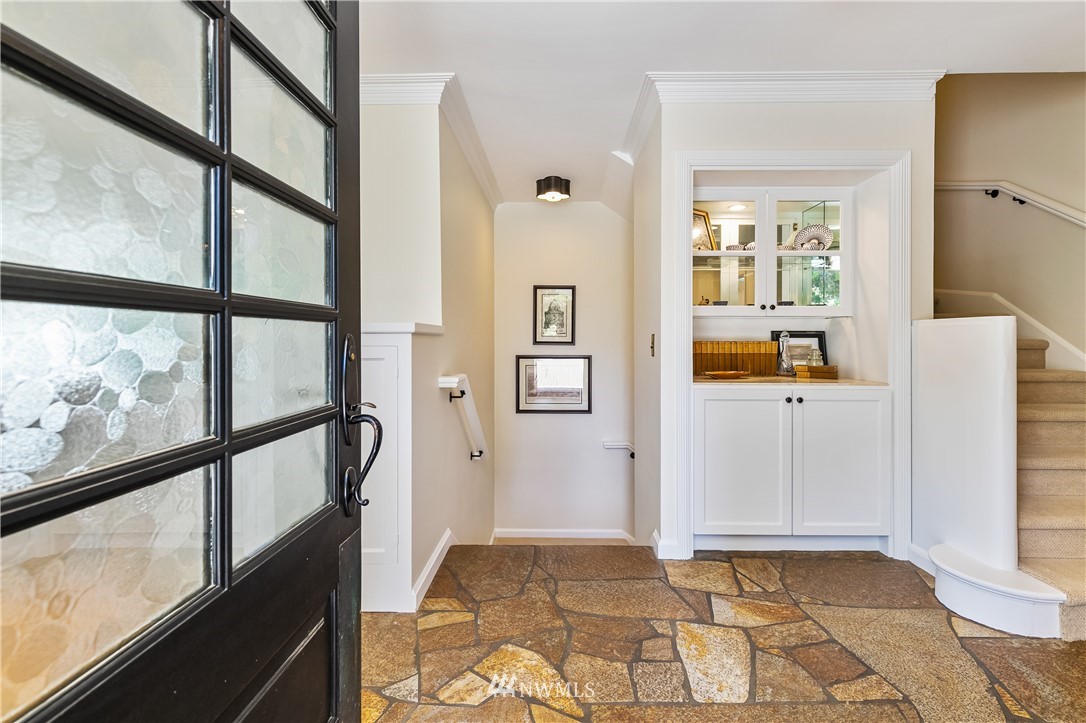245 Middlefield Road Bellingham, WA 98225 - Photo 7 of 40 a view of a hallway with wooden floor and dining room