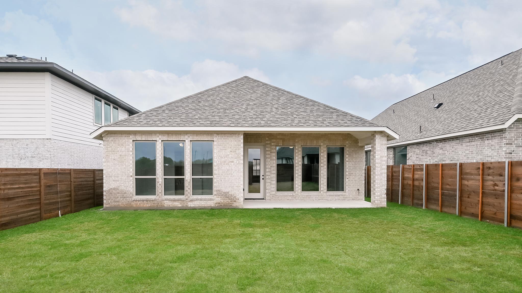 3921 Melody Road Lockhart, TX 78644 - Photo 20 of 30 front view of a house with a garden