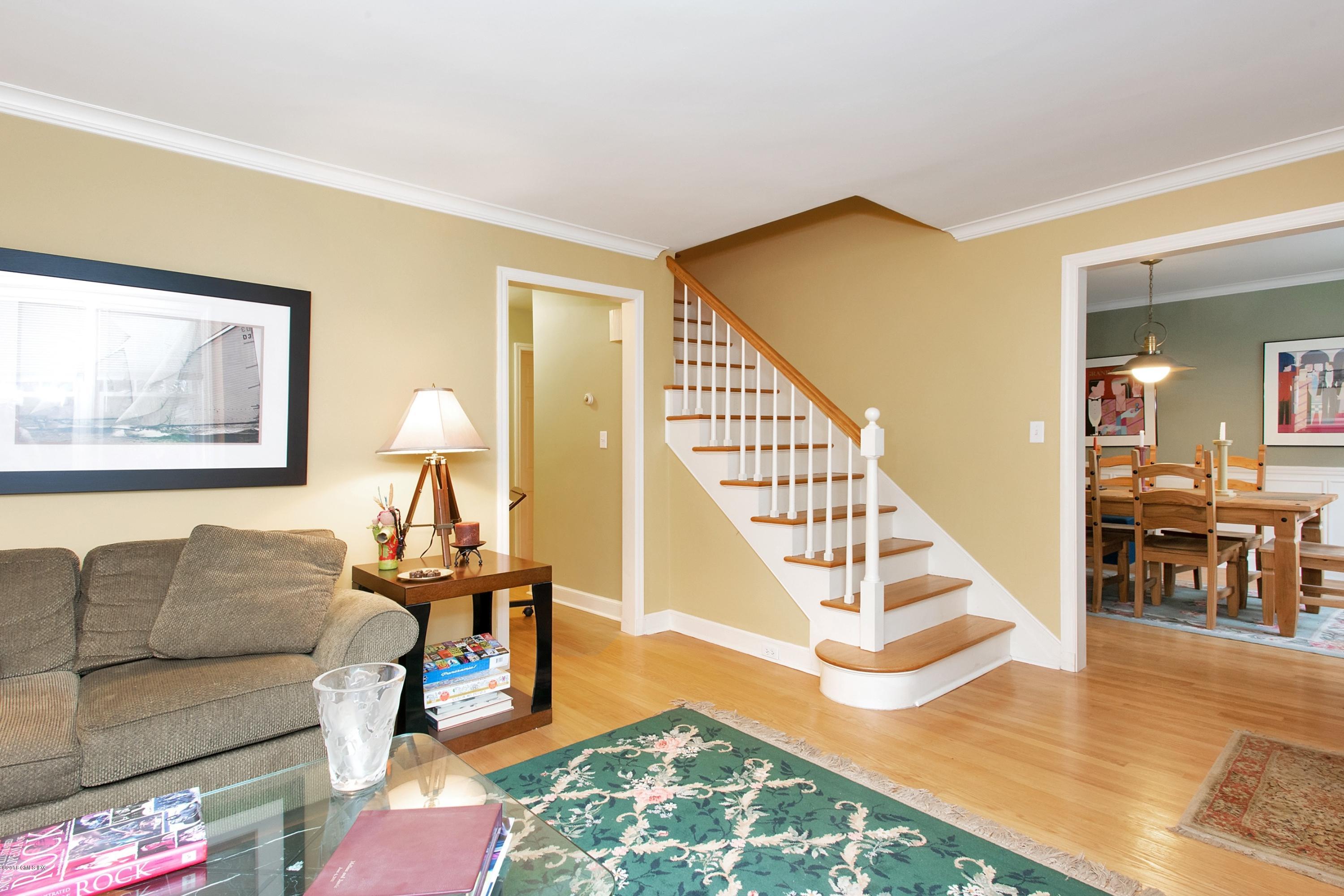 29 Talbot Lane Greenwich, CT 06830 - Photo 4 of 26 a living room with furniture and a dining table with wooden floor