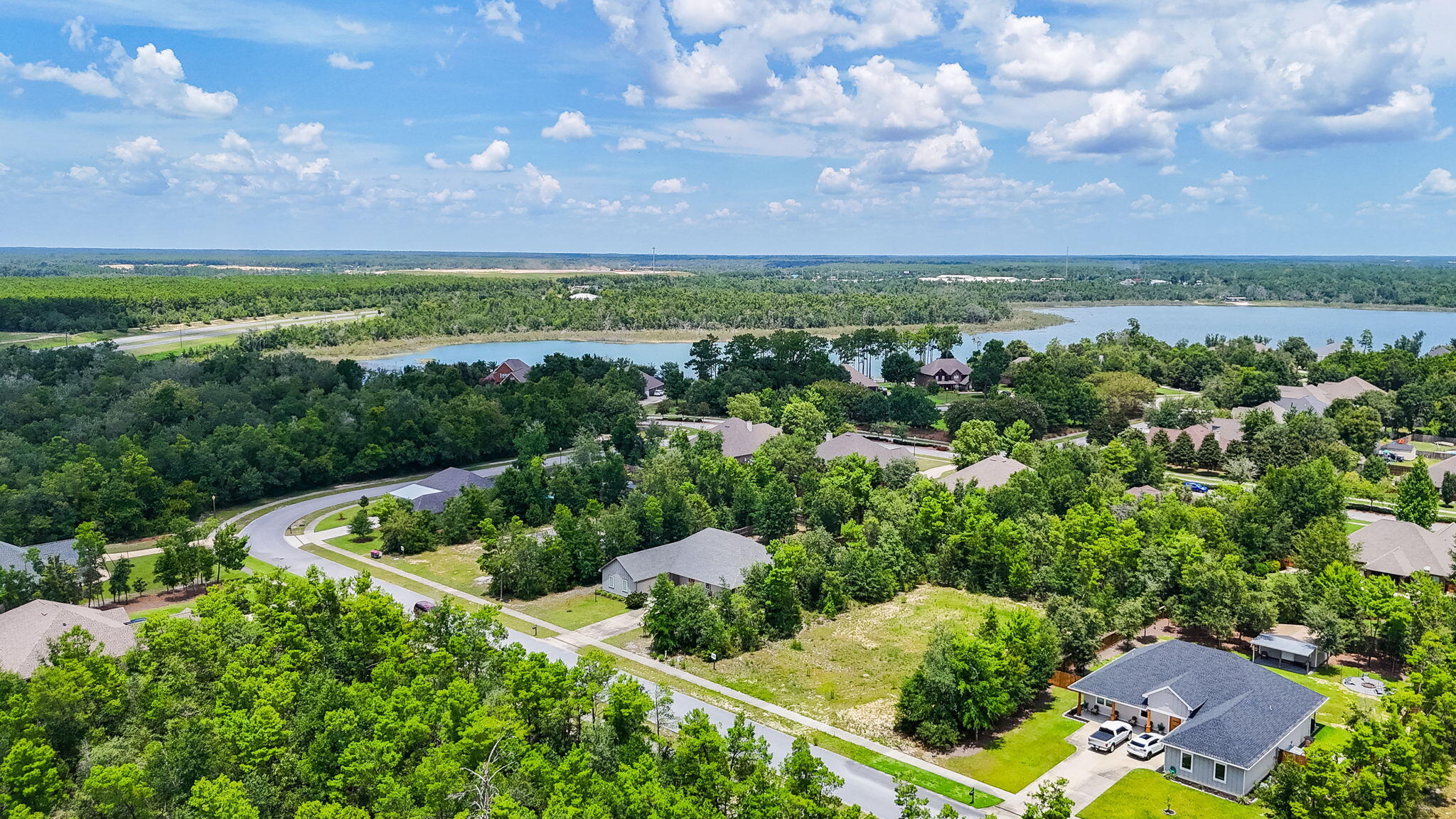 109 Lake Merial Trail Panama City, FL 32409 - Photo 2 of 12 a view of a garden with a building in the background
