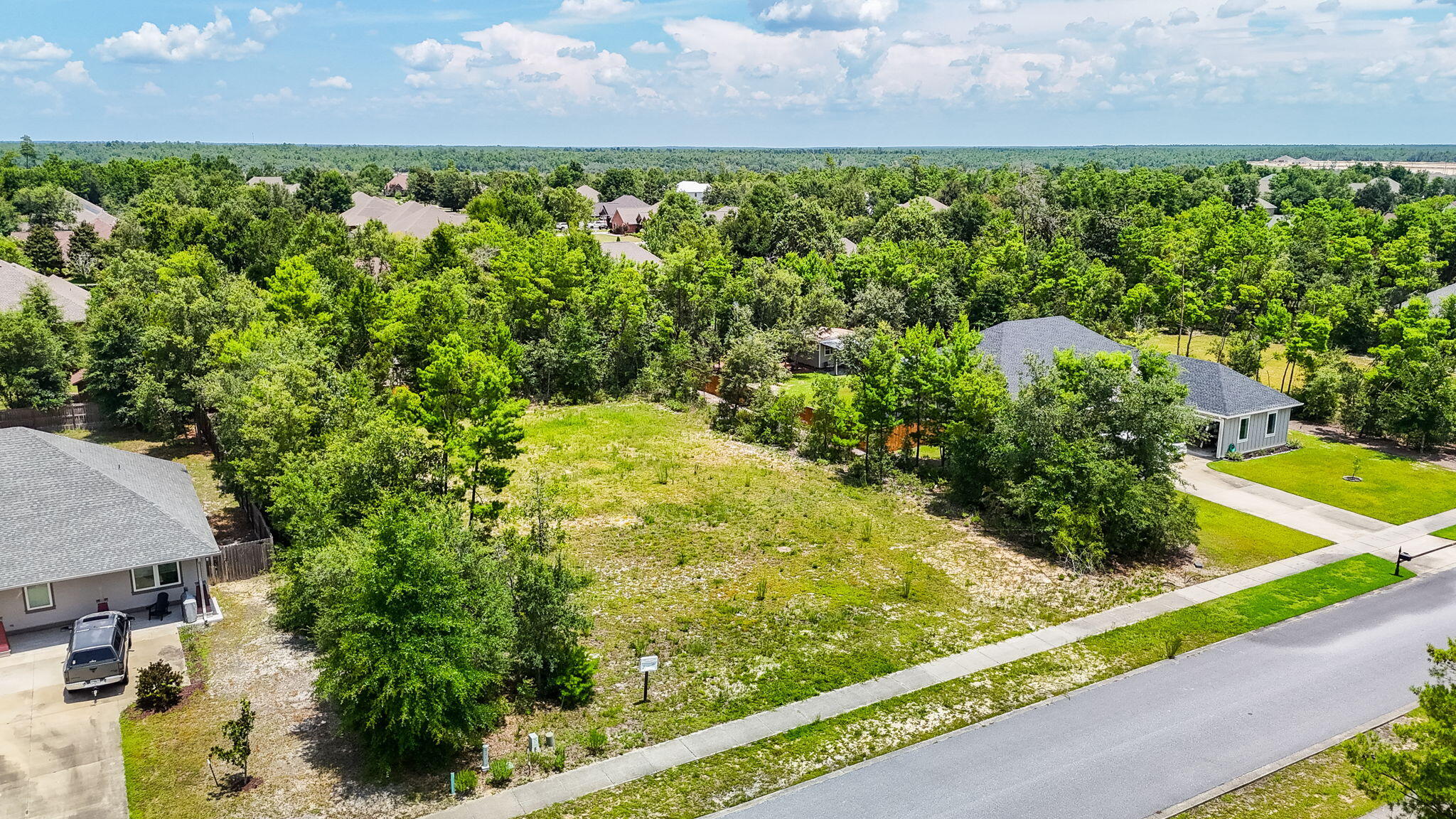 109 Lake Merial Trail Panama City, FL 32409 - Photo 6 of 12 a view of a yard with plants