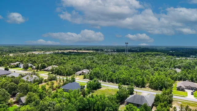 an aerial view of house with yard swimming pool and outdoor seating