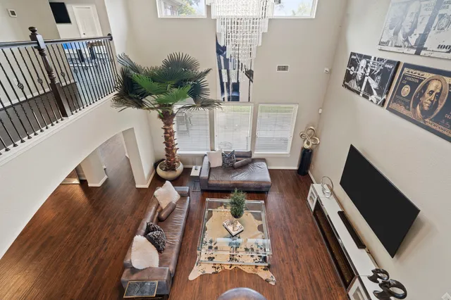 a view of a living room and a dining room with furniture