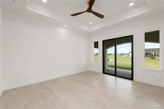 an empty room with sliding door and windows