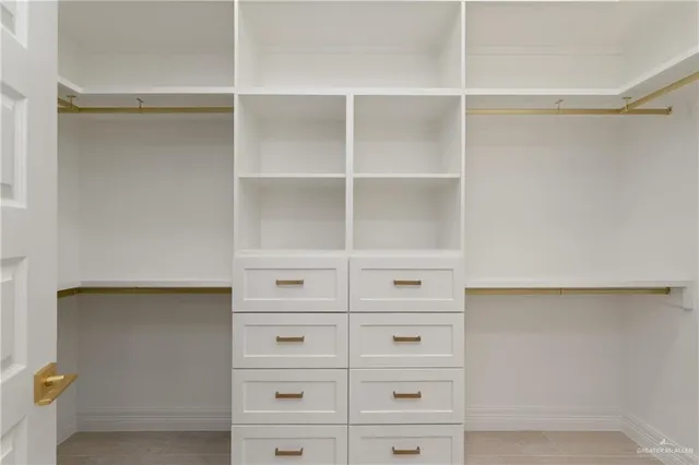 a view of an empty walk in closet