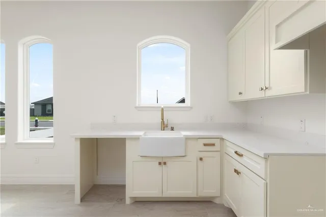 a bathroom with a sink vanity and a mirror