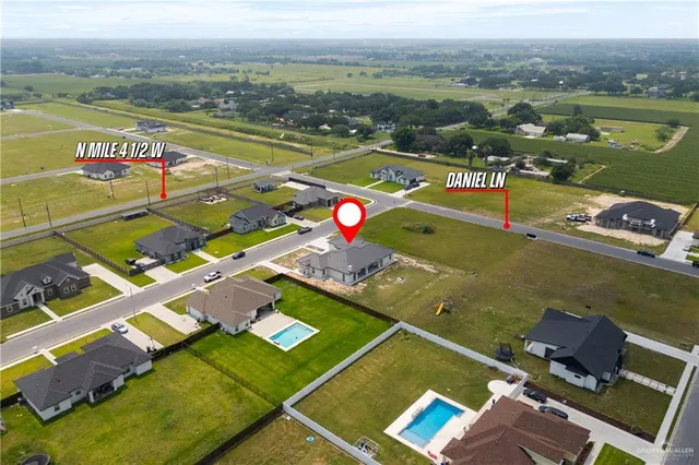 an aerial view of a house with a ocean view