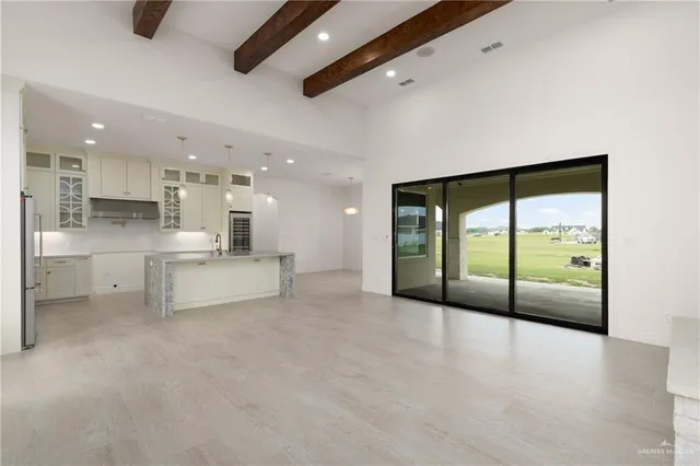 a view of a kitchen with large window