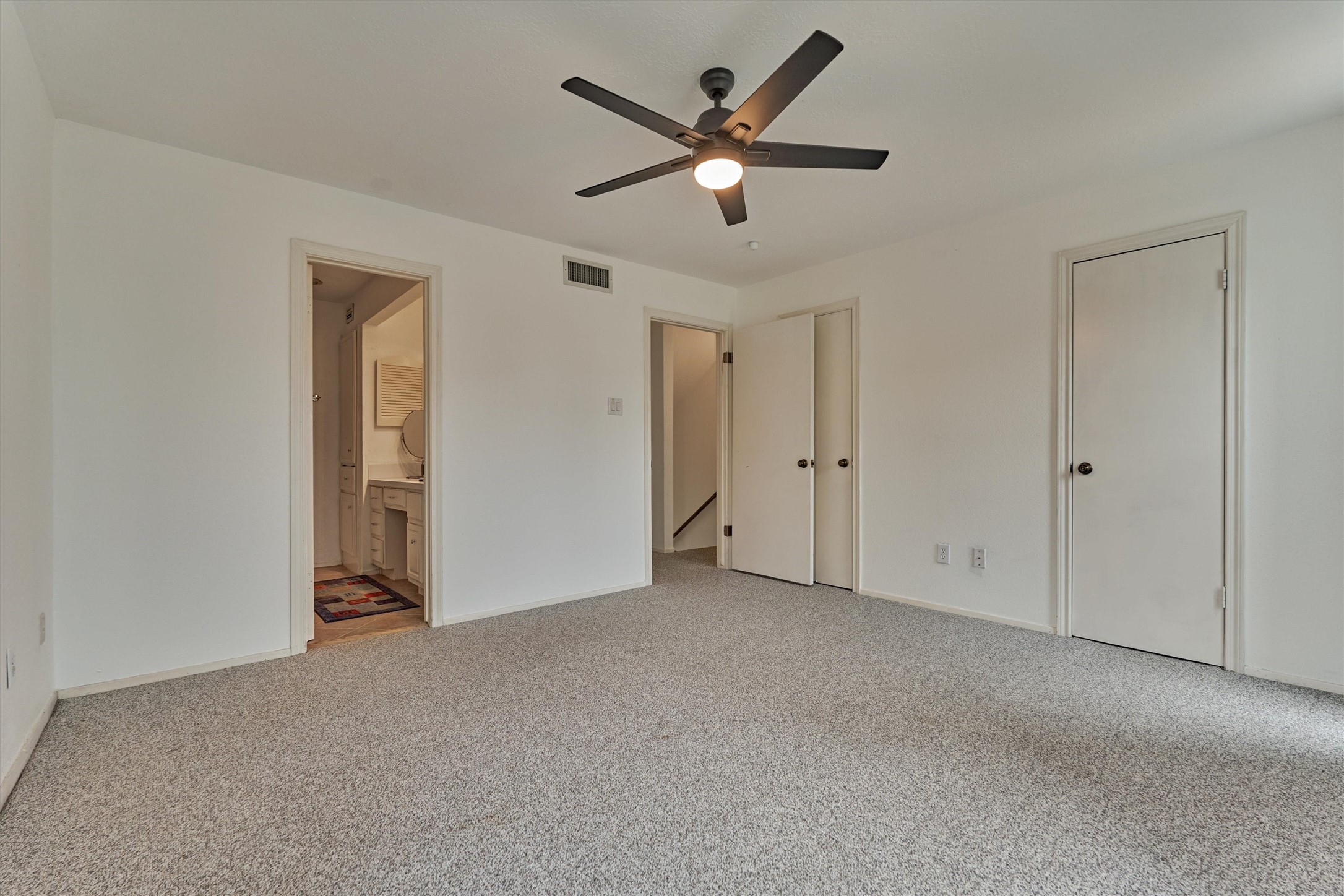 1427 Bowsprit Point Willis, TX 77318 - Photo 22 of 47 Two walk-in closets provide plenty of storage in this room and the ensuite bath provides privacy for guests.