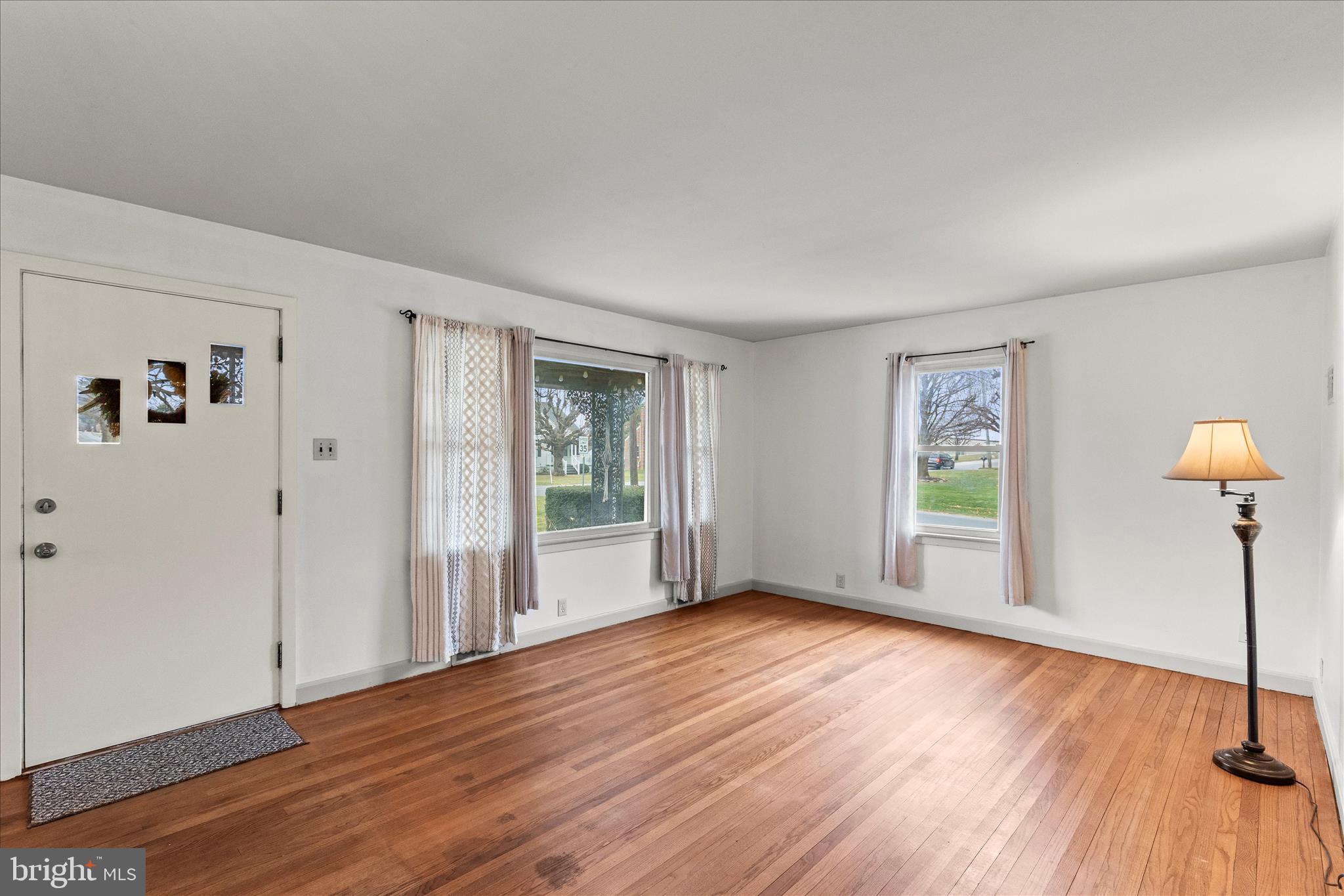 340 South Camp Street Windsor, PA 17366 - Photo 15 of 44 a view of an empty room with window and wooden floor