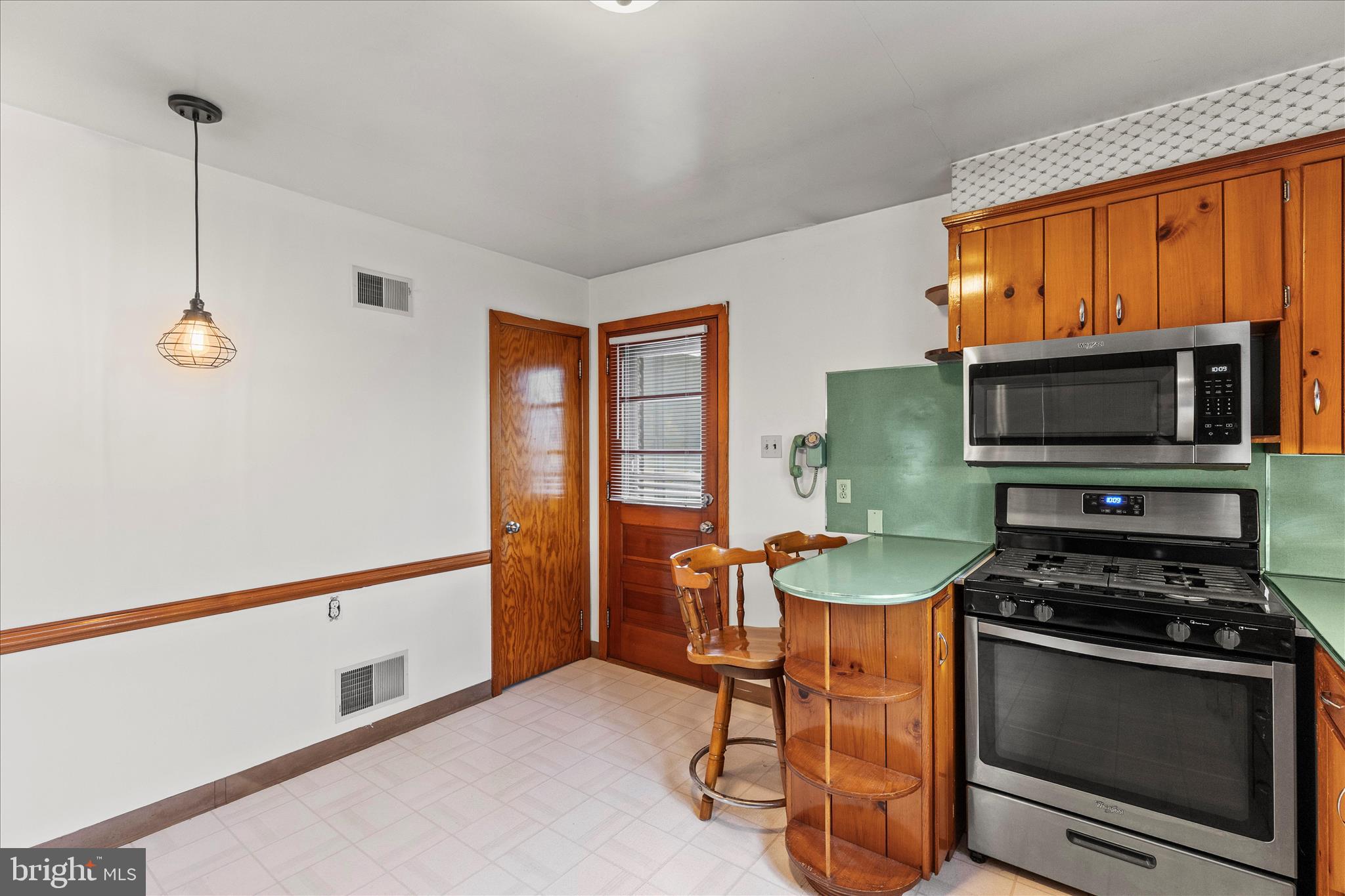 340 South Camp Street Windsor, PA 17366 - Photo 21 of 44 a kitchen with stainless steel appliances a stove a sink and a microwave