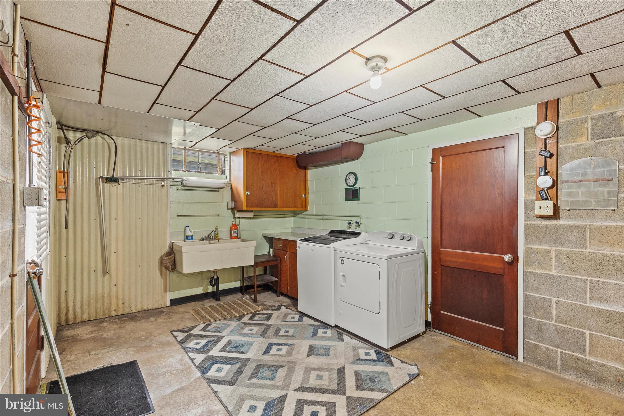 340 South Camp Street Windsor, PA 17366 - Photo 32 of 44 a room with furniture a large window and white walls