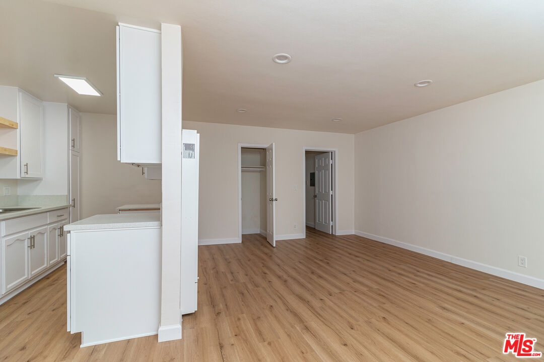 12572 Washington Boulevard, Unit 2 Los Angeles, CA 90066 - Photo 11 of 19 a view of a kitchen with wooden floor