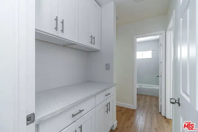 a view of cabinets and wooden floor