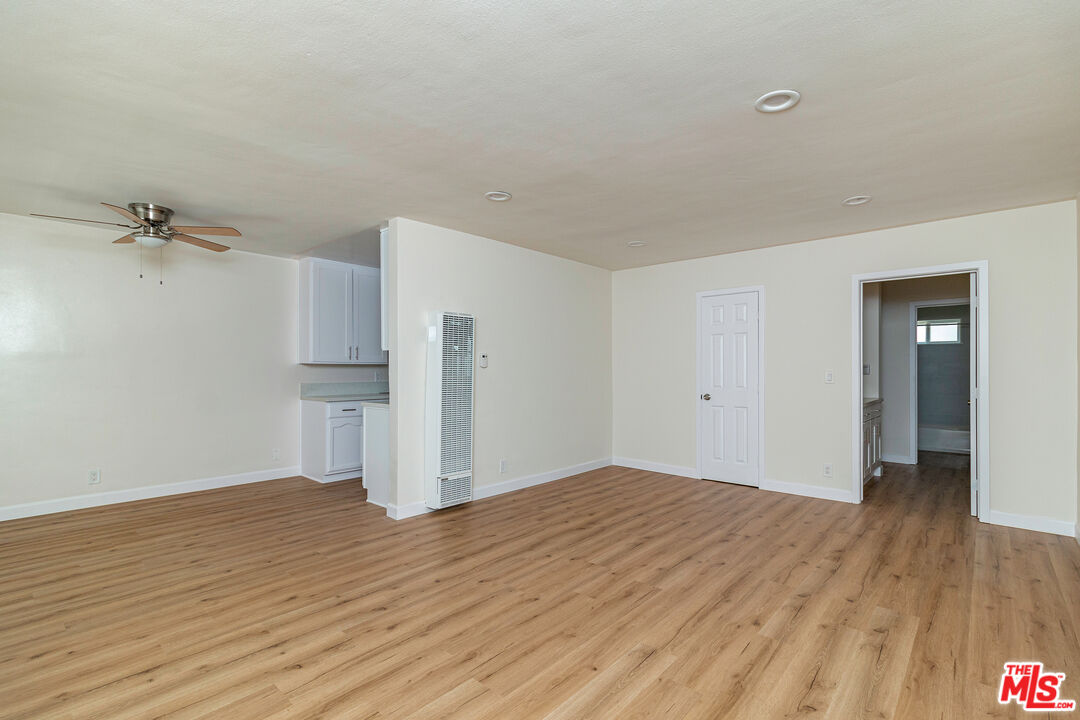 12572 Washington Boulevard, Unit 2 Los Angeles, CA 90066 - Photo 15 of 19 a view of a big room with wooden floor and a kitchen
