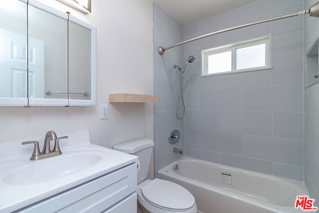 12572 Washington Boulevard, Unit 2 Los Angeles, CA 90066 - Photo 5 of 19 a bathroom with a sink toilet and shower