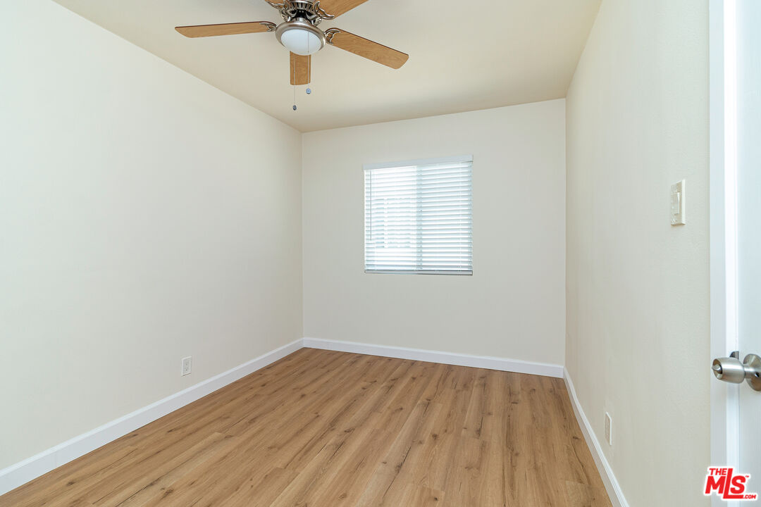 12572 Washington Boulevard, Unit 2 Los Angeles, CA 90066 - Photo 6 of 19 an empty room with a window and a ceiling fan