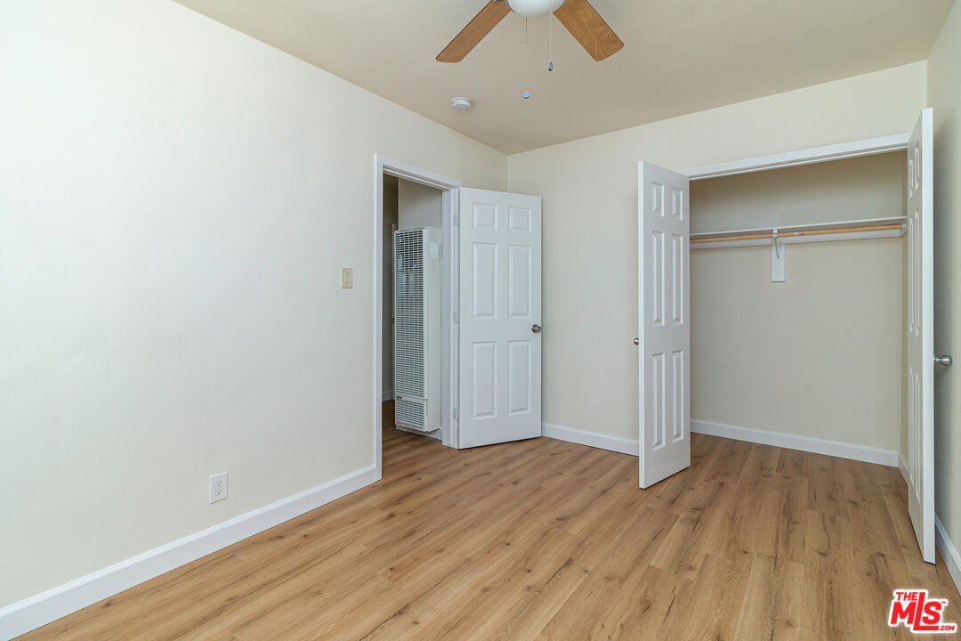 12572 Washington Boulevard, Unit 2 Los Angeles, CA 90066 - Photo 7 of 19 an empty room with wooden floor and closet