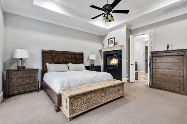 a bed room with a bed and a mirror