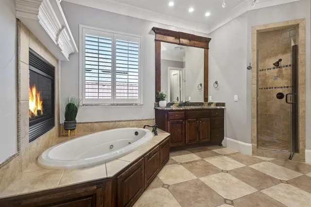 a bathroom with a tub sink and mirror