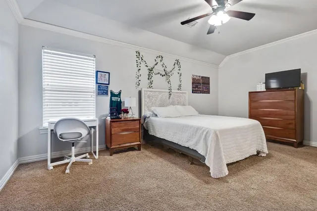 a bedroom with a bed and a chair