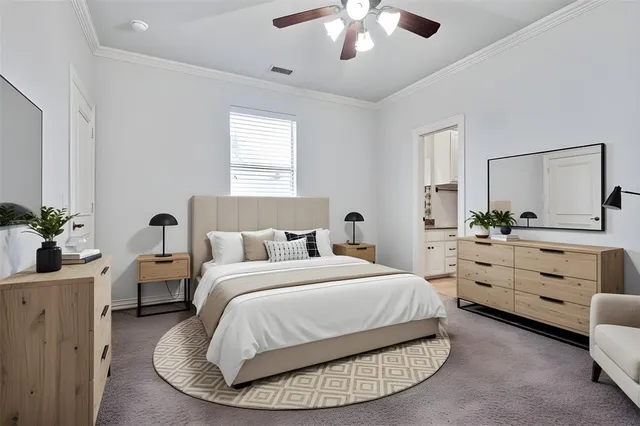 a spacious bedroom with a bed and a dresser