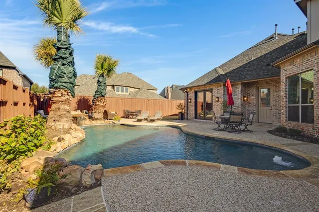 a view of a house with basketball court