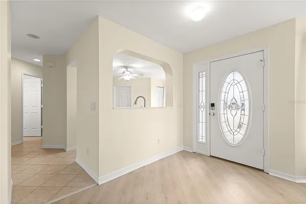 a view of an entryway with wooden floor