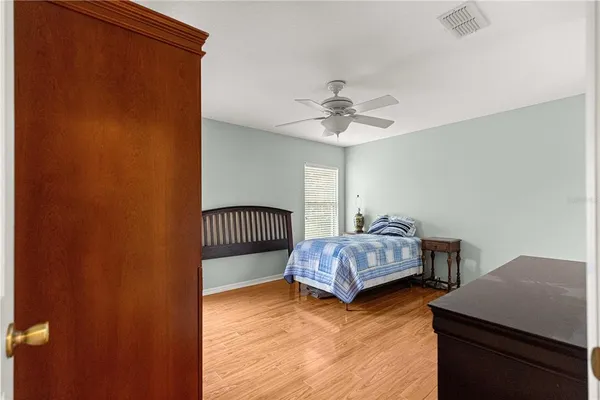 a bedroom with a bed and a table in it