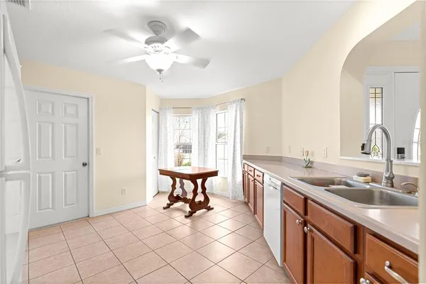 a view of a kitchen with a sink and a chandelier