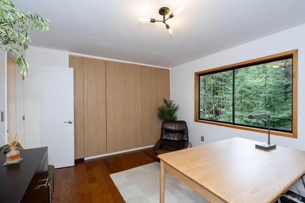 a view of kitchen with furniture and large window