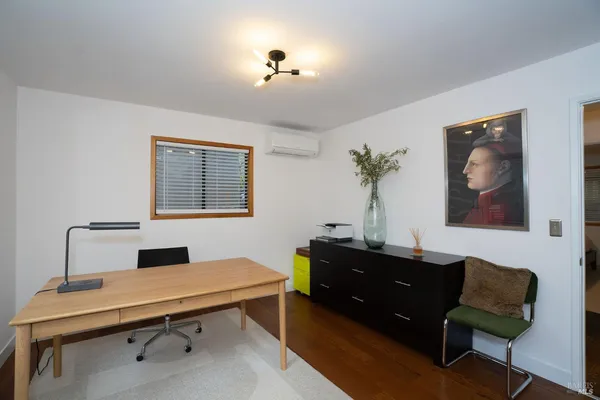 a view of a workspace with furniture