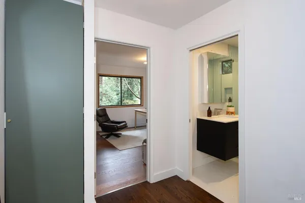 a view of a bedroom from a hallway