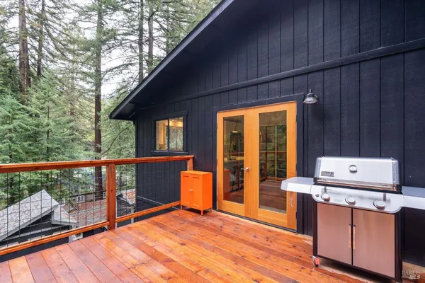 a balcony view with a flat screen tv