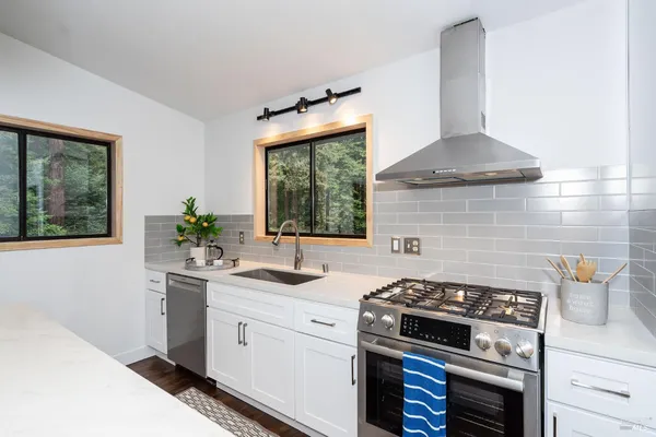a kitchen with a stove and a sink