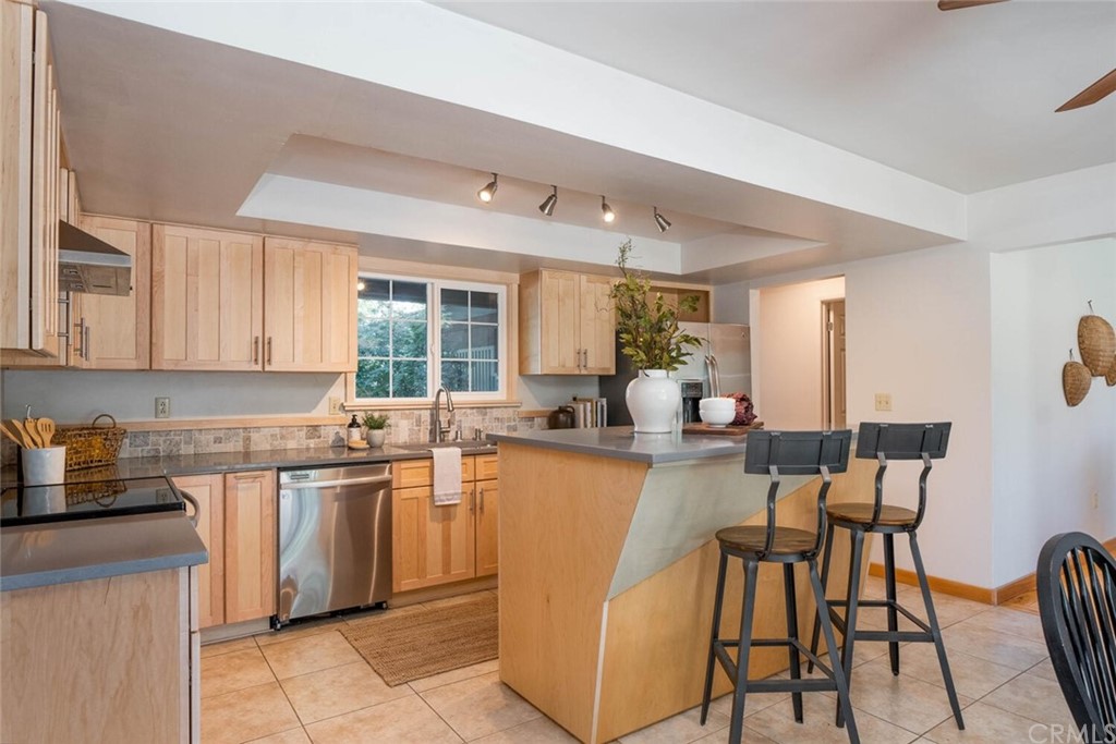 4312 Stable Lane Chico, CA 95973 - Photo 12 of 50 a kitchen with cabinets a sink and chairs in it