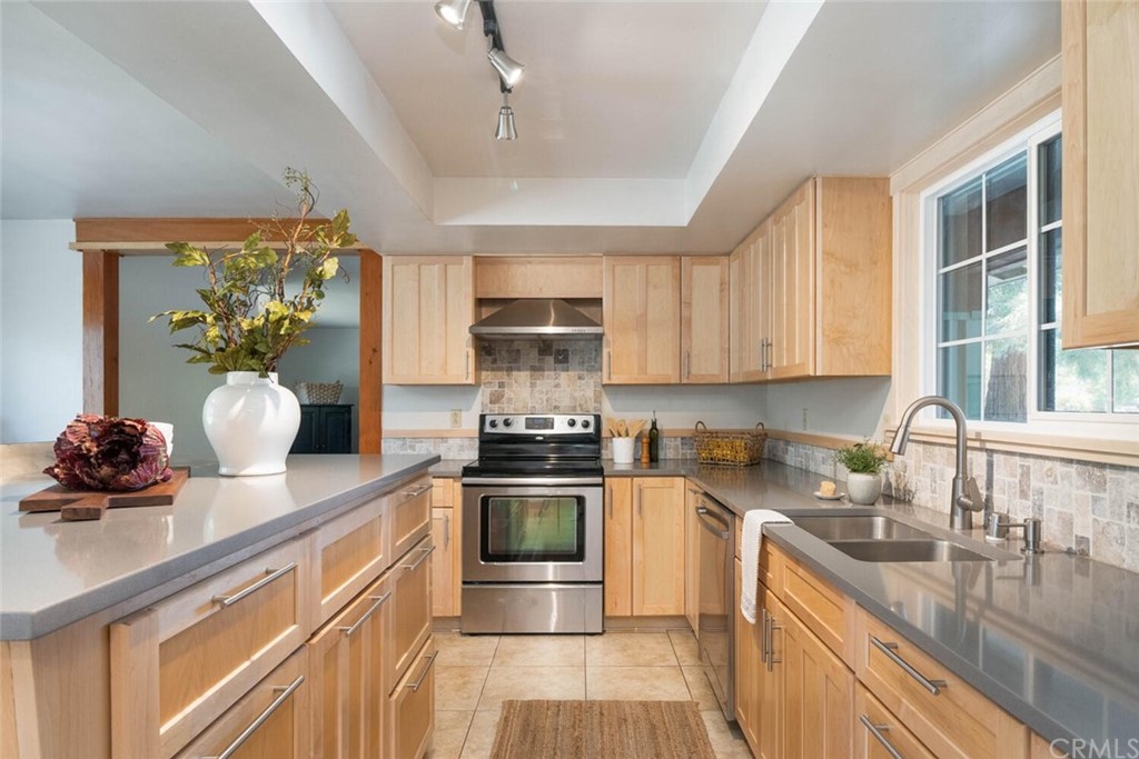 4312 Stable Lane Chico, CA 95973 - Photo 13 of 50 a kitchen with a sink stove and cabinets