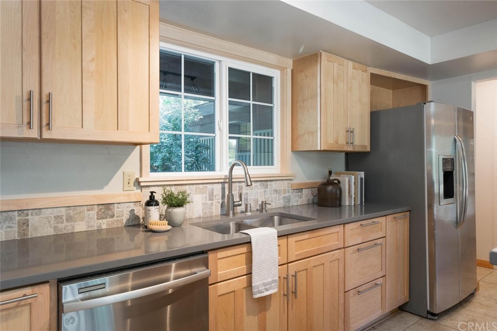 4312 Stable Lane Chico, CA 95973 - Photo 14 of 50 a kitchen with stainless steel appliances granite countertop a sink and a white cabinets