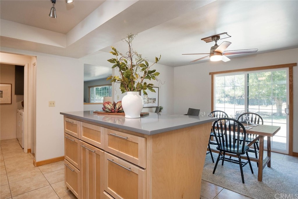 4312 Stable Lane Chico, CA 95973 - Photo 15 of 50 a dining room with furniture potted plants and wooden floor