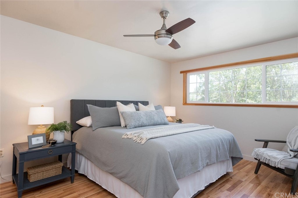 4312 Stable Lane Chico, CA 95973 - Photo 22 of 50 a bedroom with a bed and wooden floor