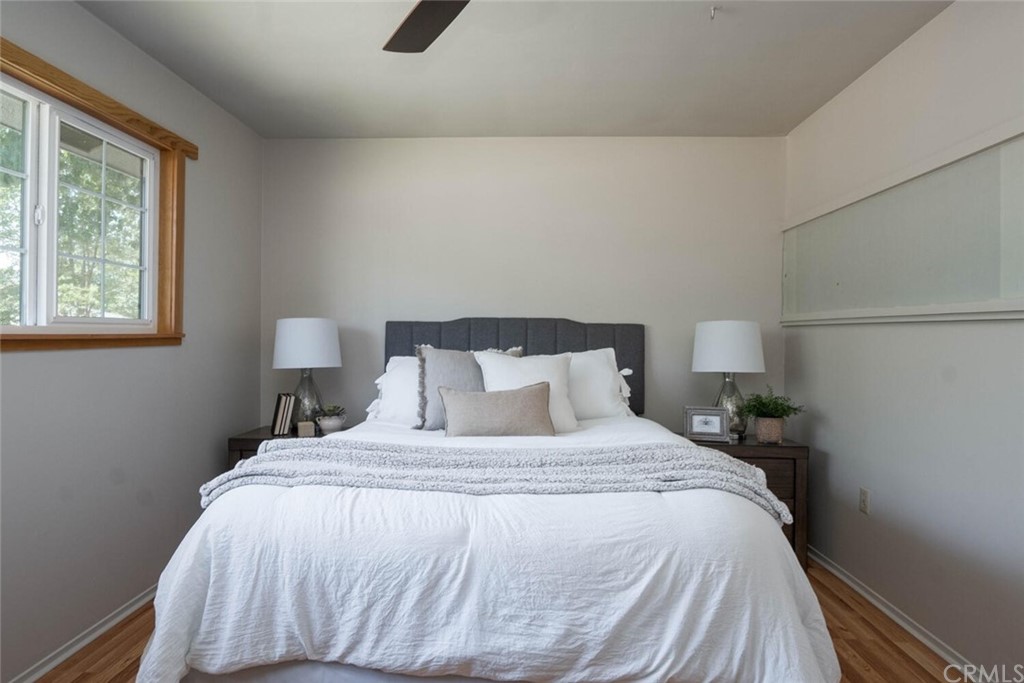 4312 Stable Lane Chico, CA 95973 - Photo 27 of 50 a bedroom with a bed and wooden floor