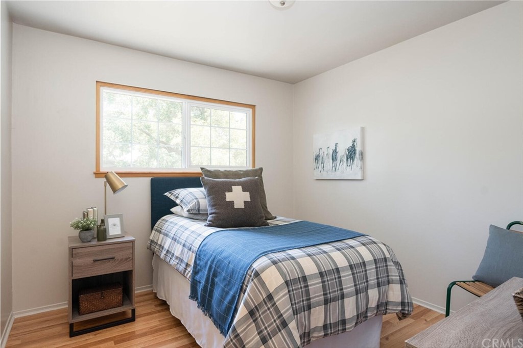 4312 Stable Lane Chico, CA 95973 - Photo 30 of 50 a bedroom with a bed and a potted plant