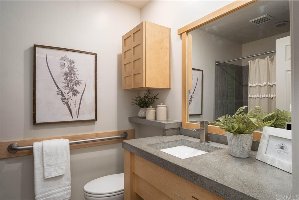4312 Stable Lane Chico, CA 95973 - Photo 32 of 50 a bathroom with a granite countertop sink and a mirror