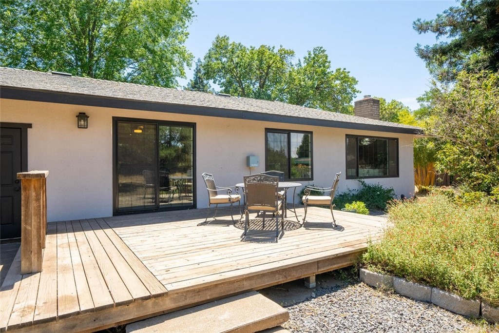 4312 Stable Lane Chico, CA 95973 - Photo 36 of 50 a view of a patio with table and chairs with wooden floor and fence