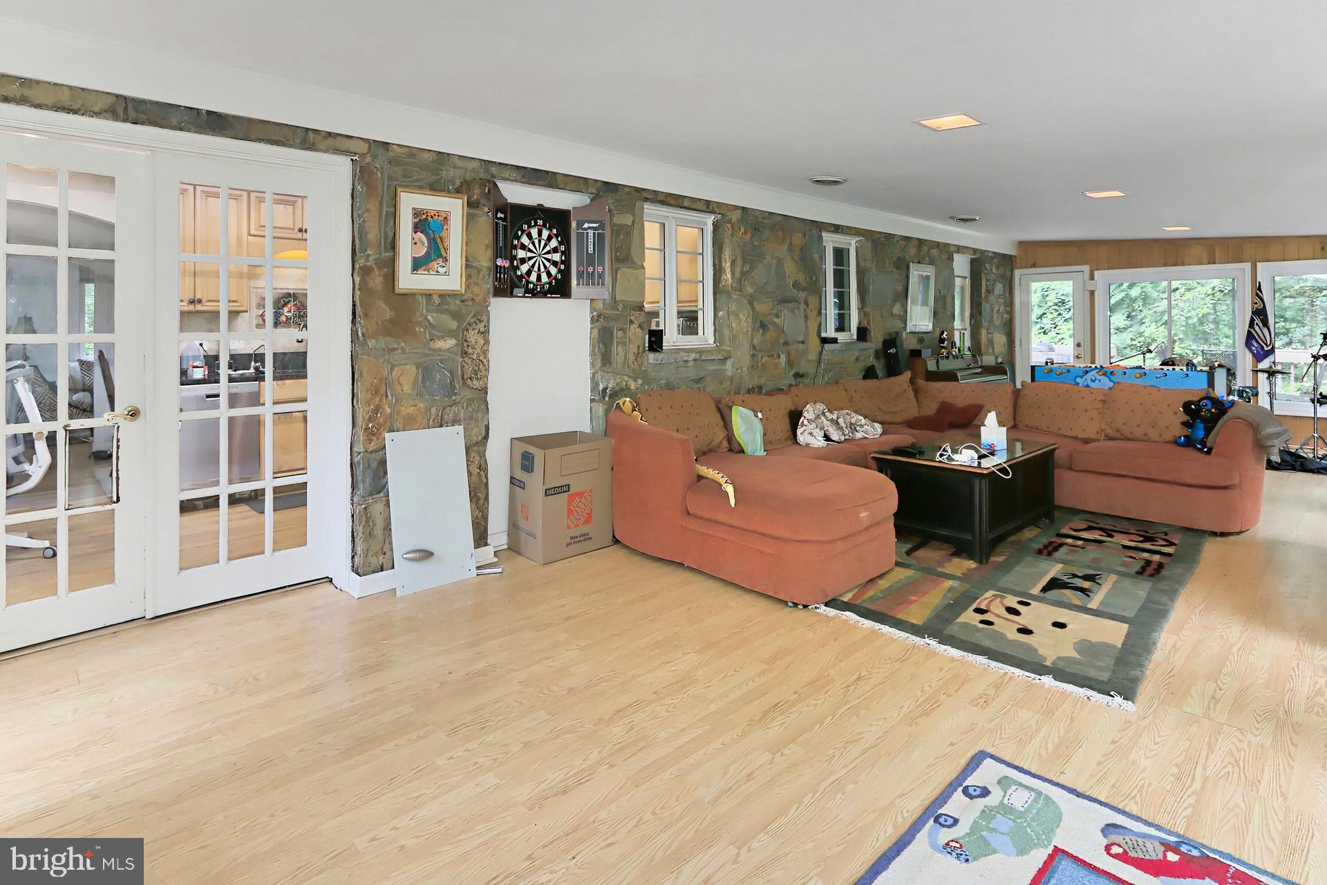 1431 Beulah Road Vienna, VA 22182 - Photo 16 of 52 Large main lvl family room featuring a stone wall