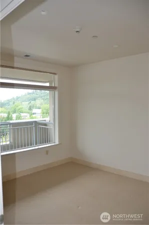 a view of a small space with a large window